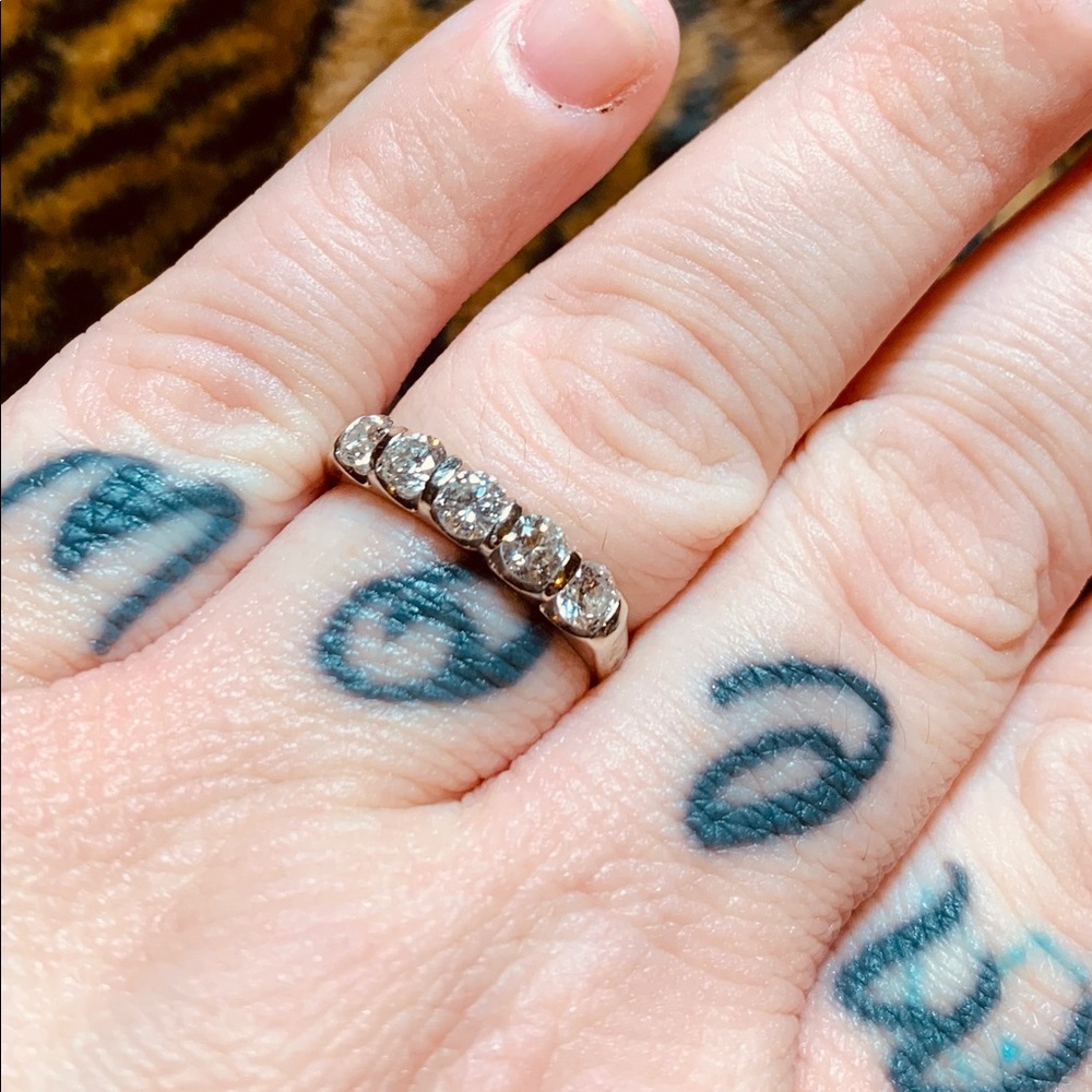 1ct, 5 Diamond tension set wedding band